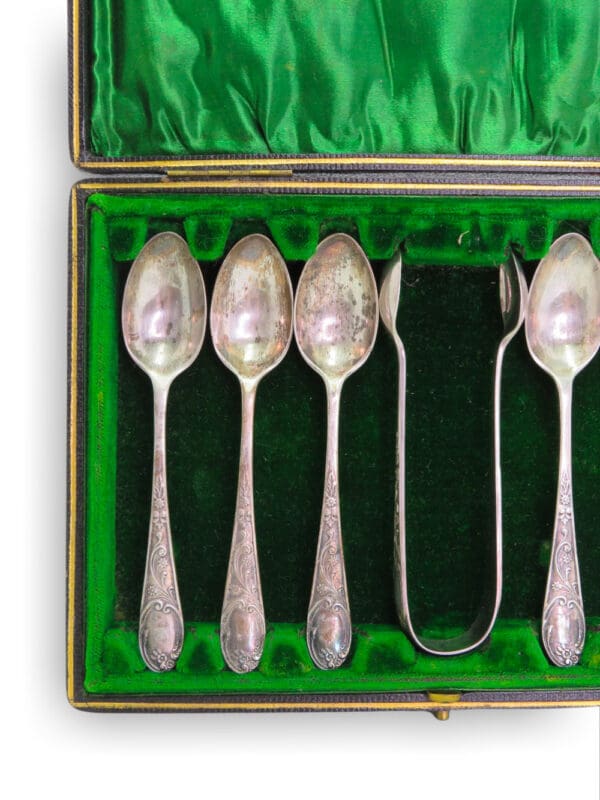 Dainty silver spoon set.