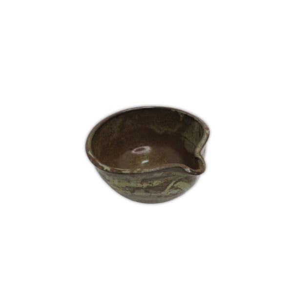 brown pottery bowl with pouring spout