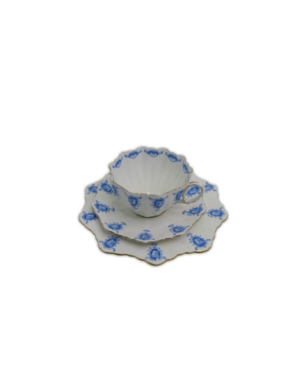 White tea cup and plate set with blue pattern