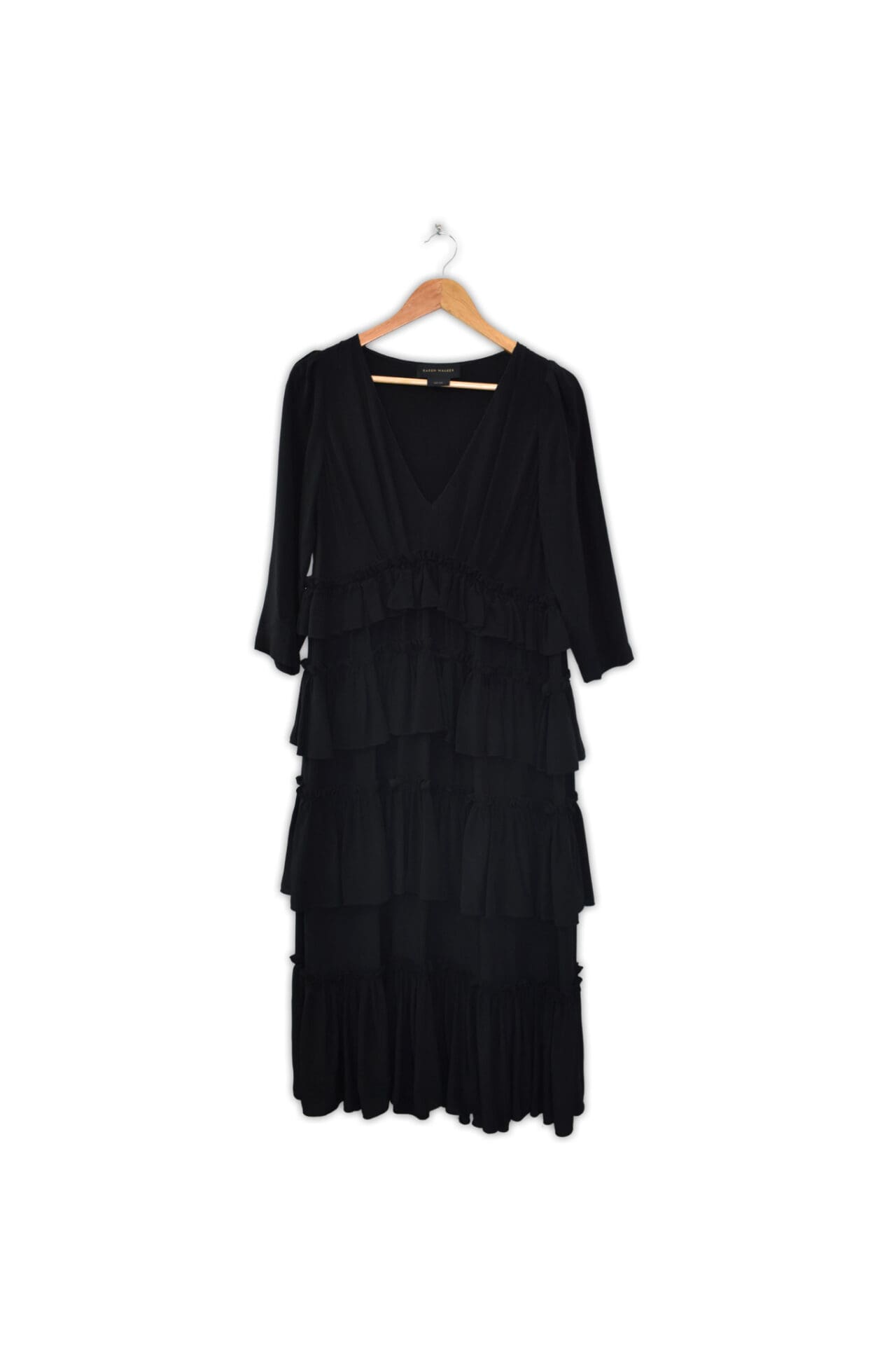 Frilly, long sleeve dress. Made in China.
