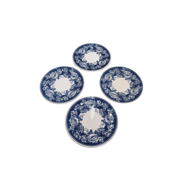 Crabtree & Evelyn China plates from Mason's Ironstone are decorated with a soft blue and ivory palette, featuring an assortment of floral designs. Three of the plates are all a medium size, 22cm in diameter with one slightly smaller plate.