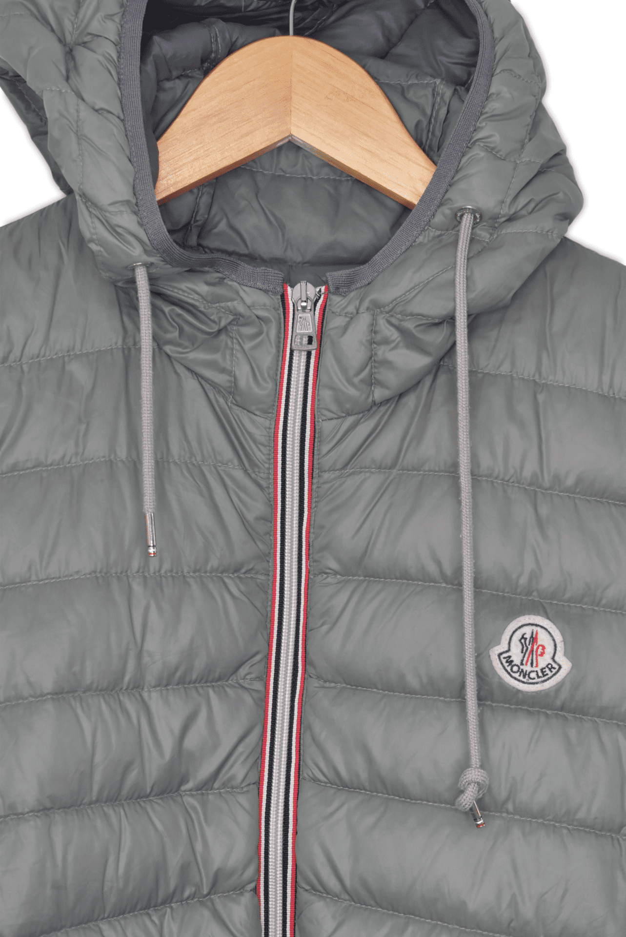 Small, light green. A hooded light weight puffer, featuring two front zip pockets and a Moncler patch logo.