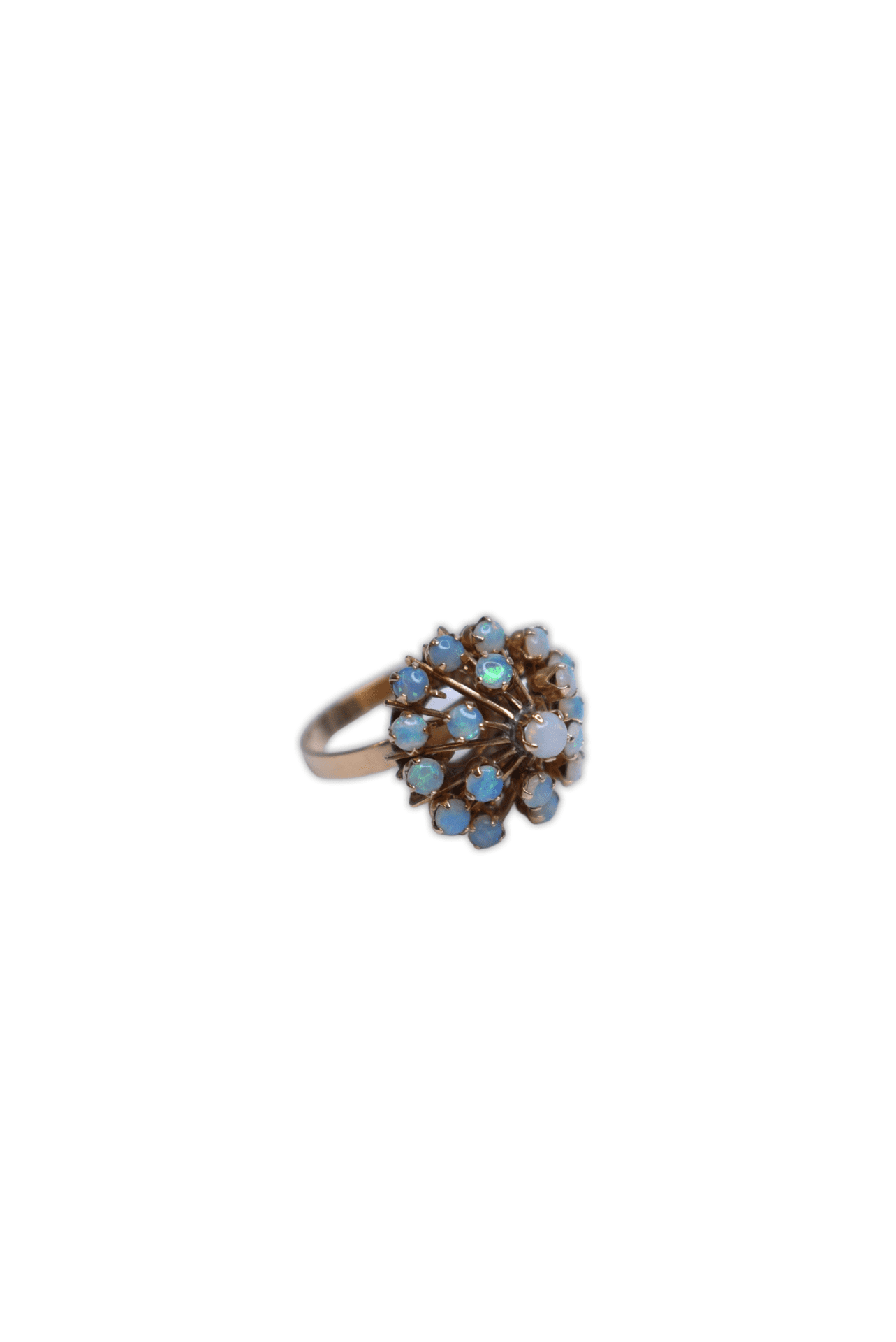 Dove Hospice and Wellness. Stunning 14 carat gold ring with 19 small set in opal stones.