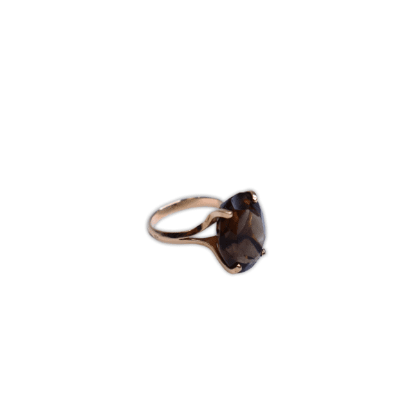 Large smokey quarts with an oval cut set in a delicate 14 carat gold ring. Size: 17.1mm / NZ N
