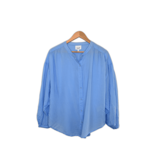 Light weight Blouse featuring a yoke with gathered fullness, long sleeves and a mandarin collar. 