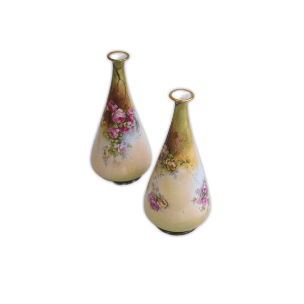 Floral vase with a wide base and narrow neck featuring a gold rim and delicate rose print. 