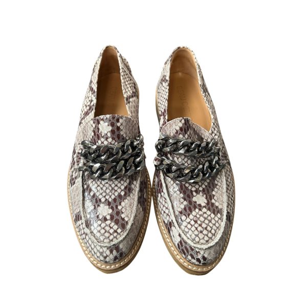 Snakeskin loafers with chain detail.